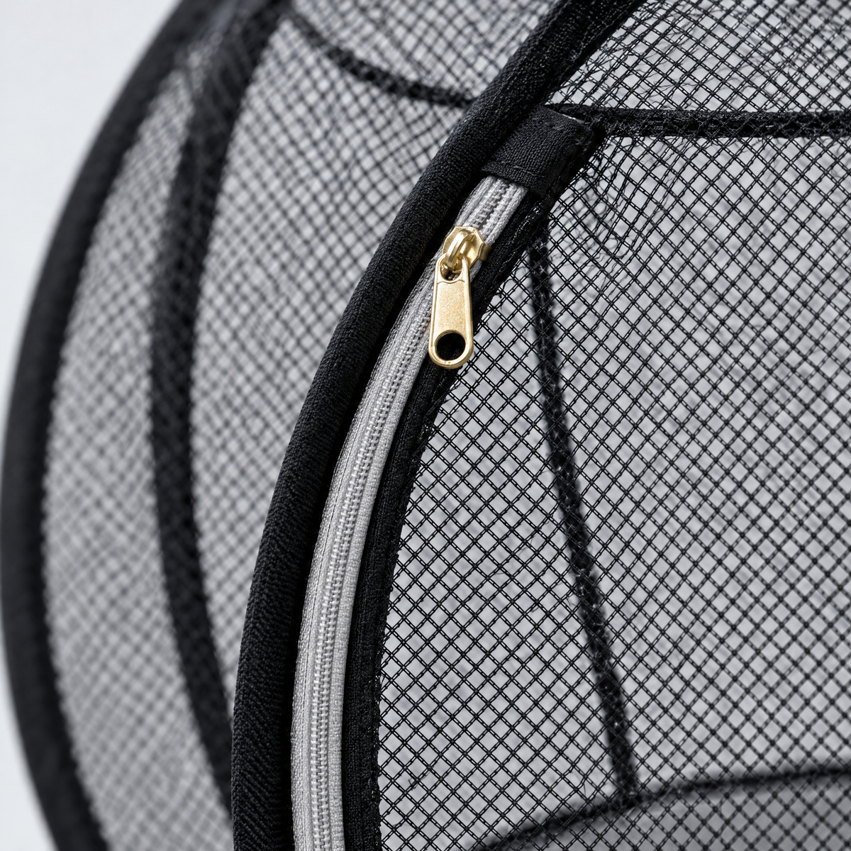 Close-up of the diamond-weave mesh and zipper